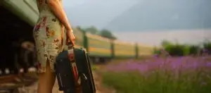 angie strader image of woman with suitcase to run away