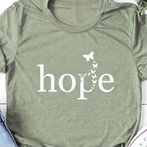 Green short sleeved t-shirt with the graphic printed hope and butterflies